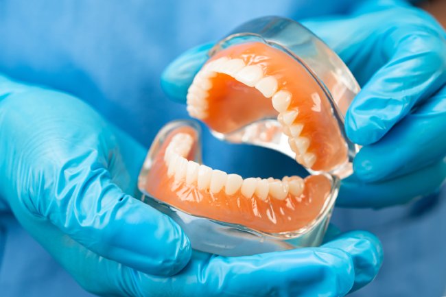 What does getting dentures involve?